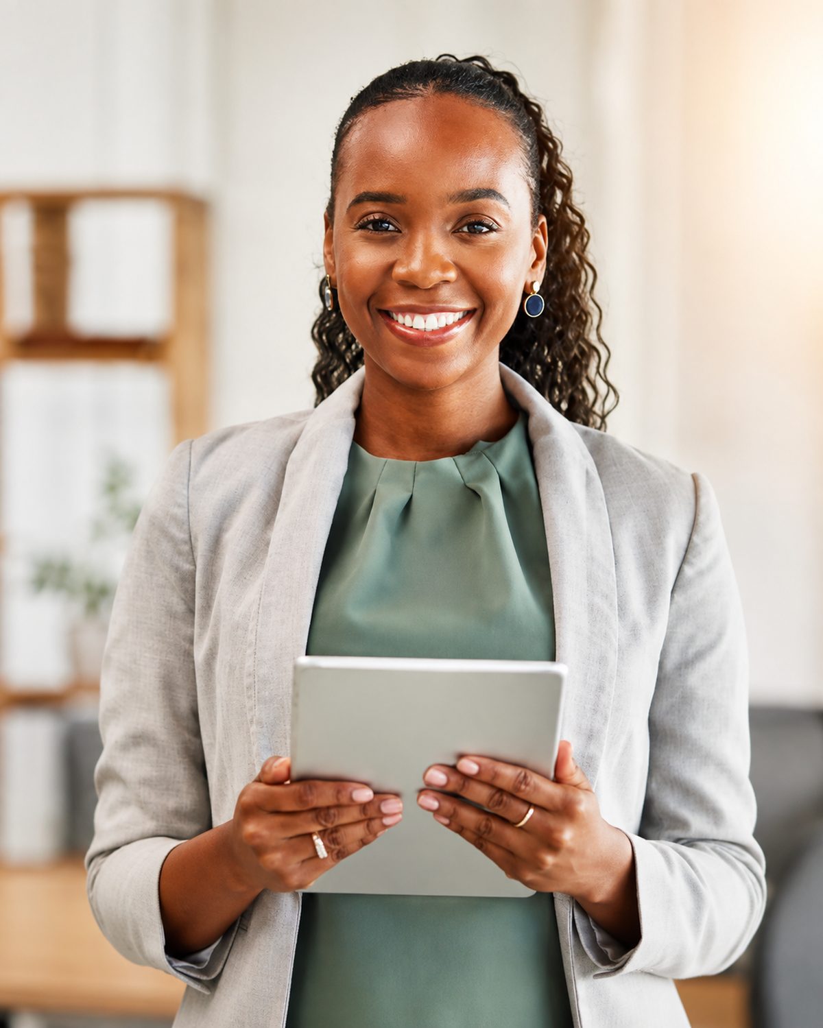 A professional reviewing candidates on a tablet